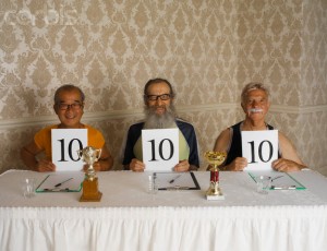 Three Smiling Judges Holding up Perfect Ten