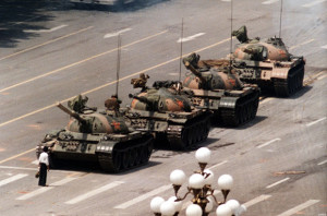 A Chinese protestor blocks a line of tanks heading east on Beijing's Changan Blvd. June 5, 1989 in front of the Beijing Hotel. The man, calling for an end to the violence and bloodshed against pro-democracy demonstrators at Tiananmen Square, was pulled away by bystanders, and the tanks continued on their way.